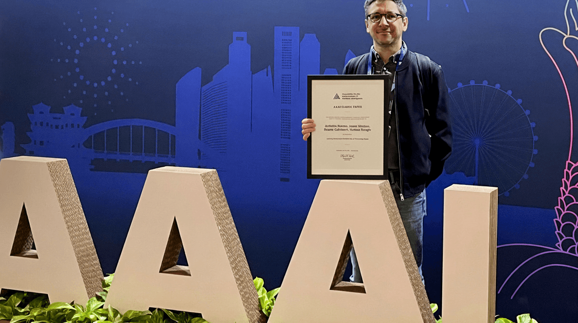 Antoine Bordes holding the AAAI award